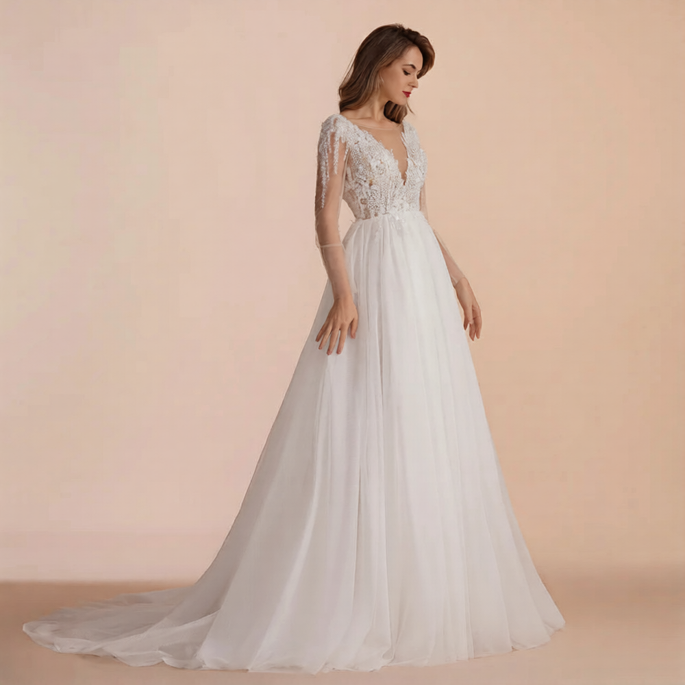 Robe de mariée élégante de la marque Robe de mariée Paris avec voile en dentelle et bustier sophistiqué.