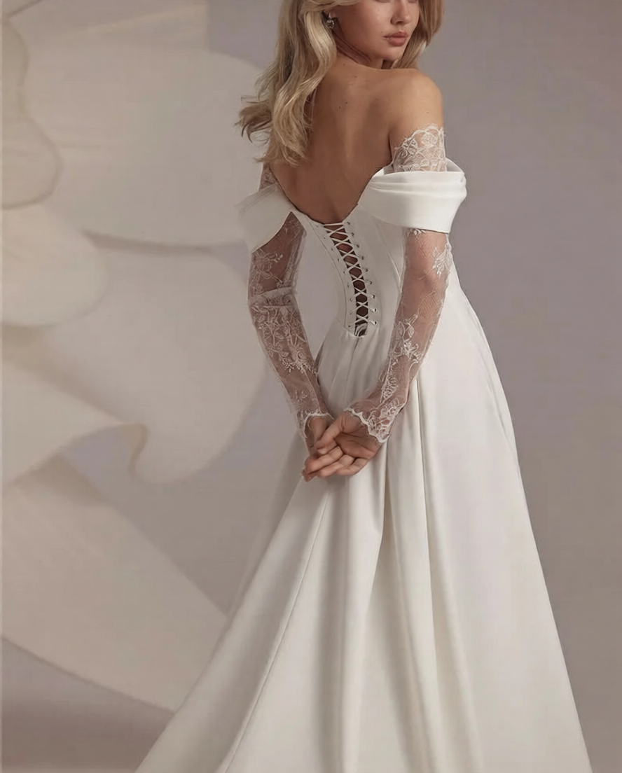 Robe de mariée haute couture de Robe de mariée Paris avec dentelle élégante et bustier ajusté, sur mannequin blanc.