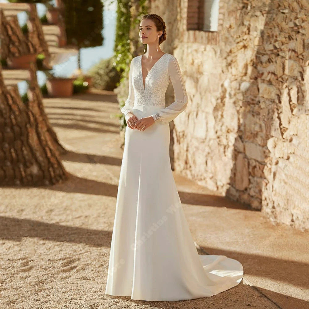 Robe de mariée bohème avec manches 3/4, détail en dentelle et tissu fluide, modèle élégant pour mariage romantique