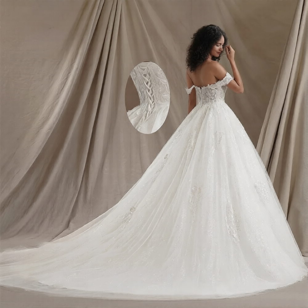 Robe de mariée de luxe Robe de mariée Paris avec dentelle élégante et jupe fluide, portée lors d'une cérémonie nuptiale.