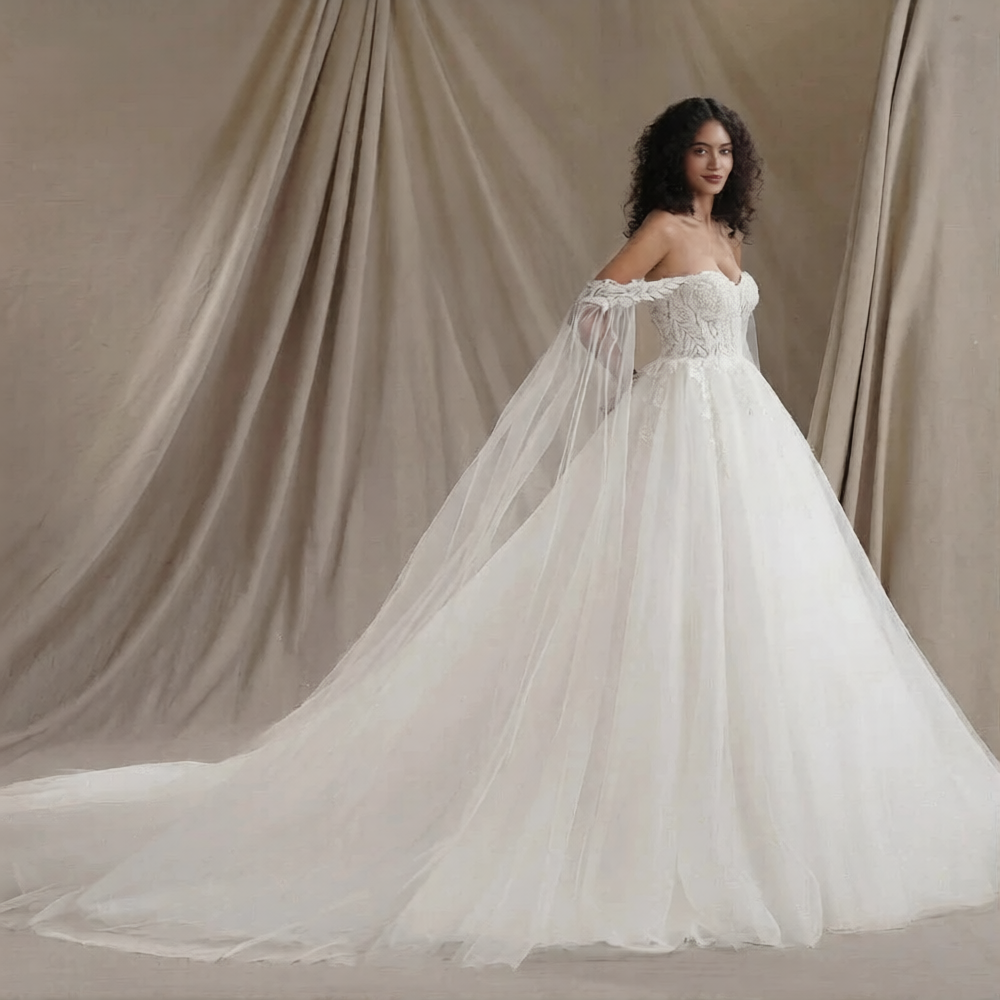 Robe de mariée épaule dénudée de la marque Robe de mariée Paris, élégante avec détails en dentelle et style sophistiqué.